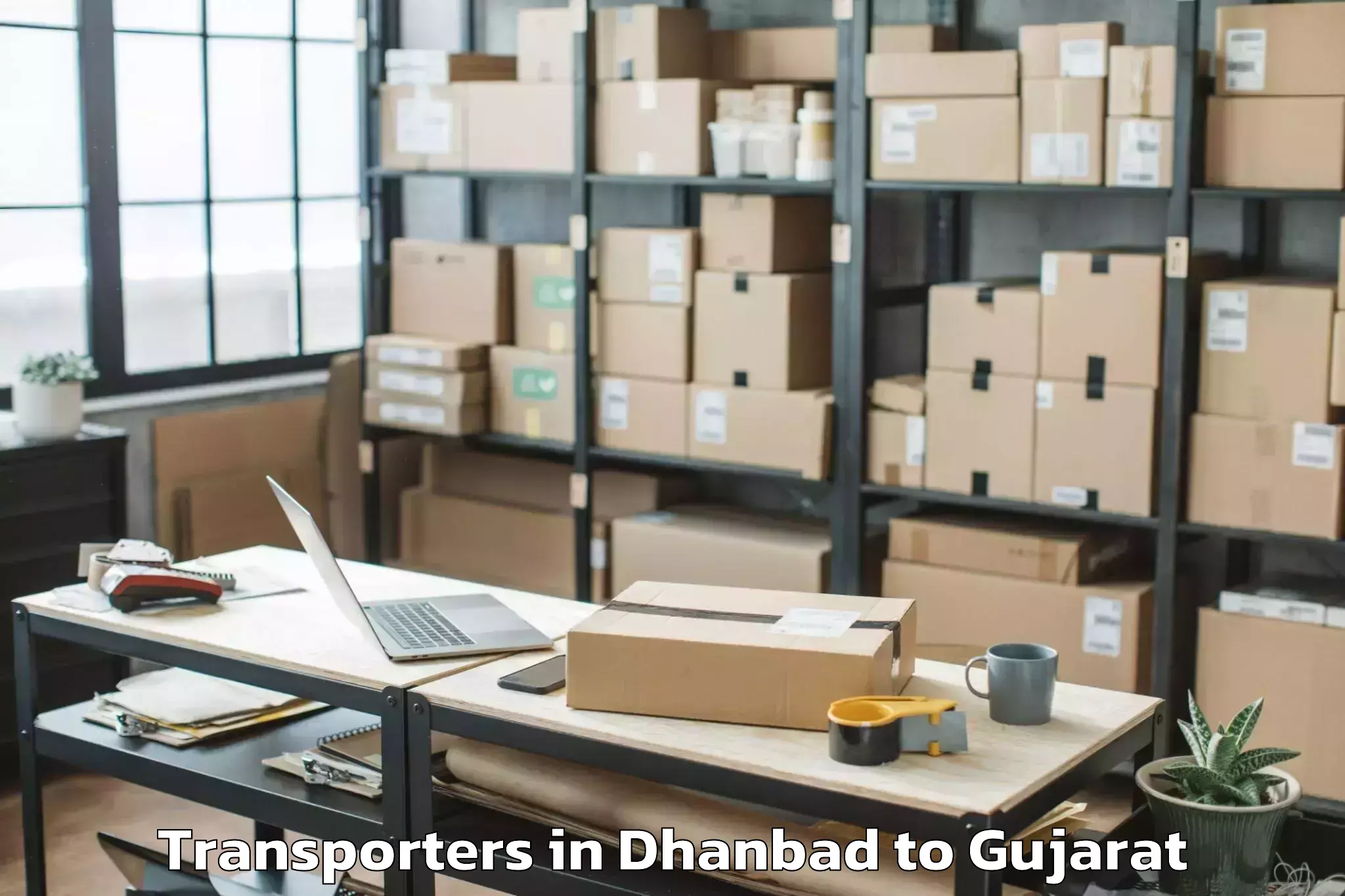 Dhanbad to Gidc Transporters Booking